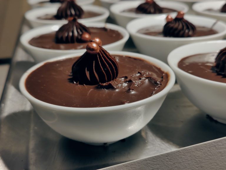 Dark chocolate mousse served in white ceramic dish