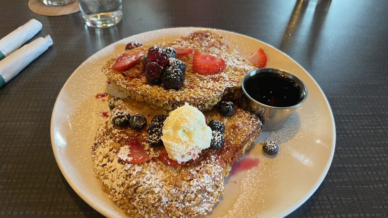 Cornflake encrusted waffles with strawberries, blueberries, bourbon soaked cherries, and bourbon maple syrup.