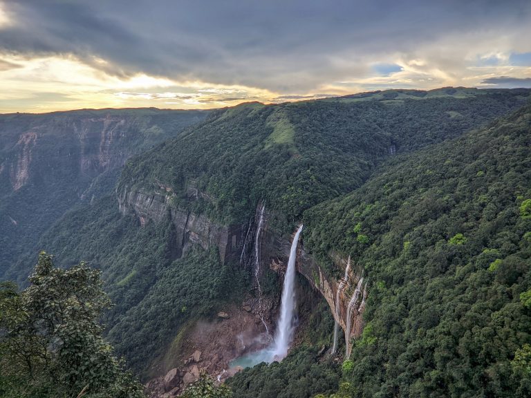 Witnessing the awe-inspiring Nohkalikai Falls in all its glory, surrounded by lush greenery and misty clouds, is truly a mesmerizing experience.