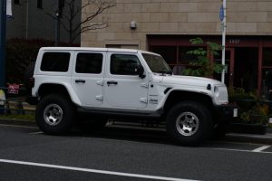 A Jeep parked on a street corner in Tokyo, Japan
