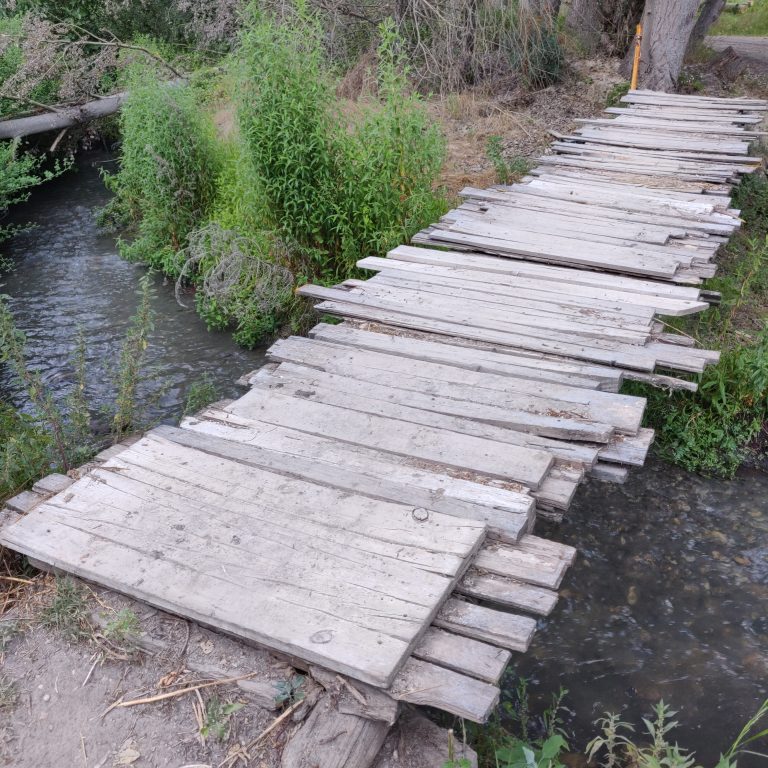 Wooden bridge over a small river