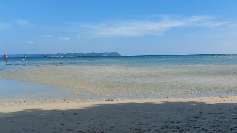 Sandy beach at low tide.