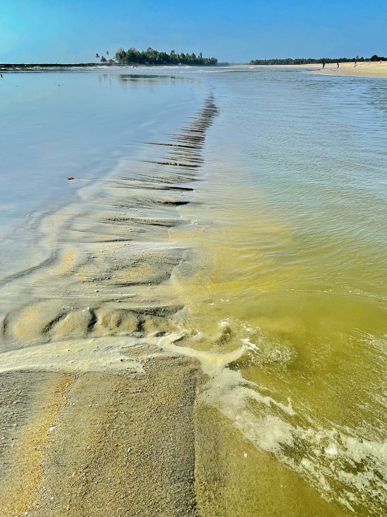 Kuttiyadi river joins in Arabian Sea during low tide. Kozhikode, Kerala, India