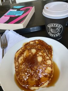 Pancakes, book and coffee