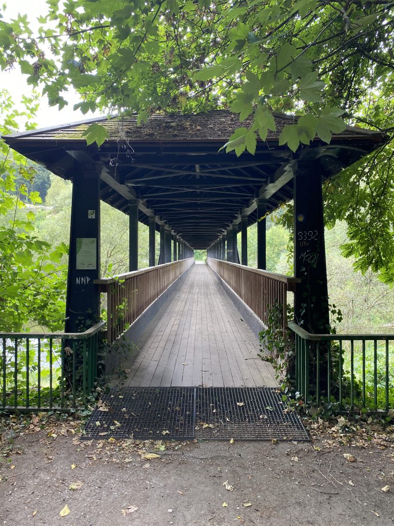 A dark bridge across the river Sauer in Echternach, Luxembourg.