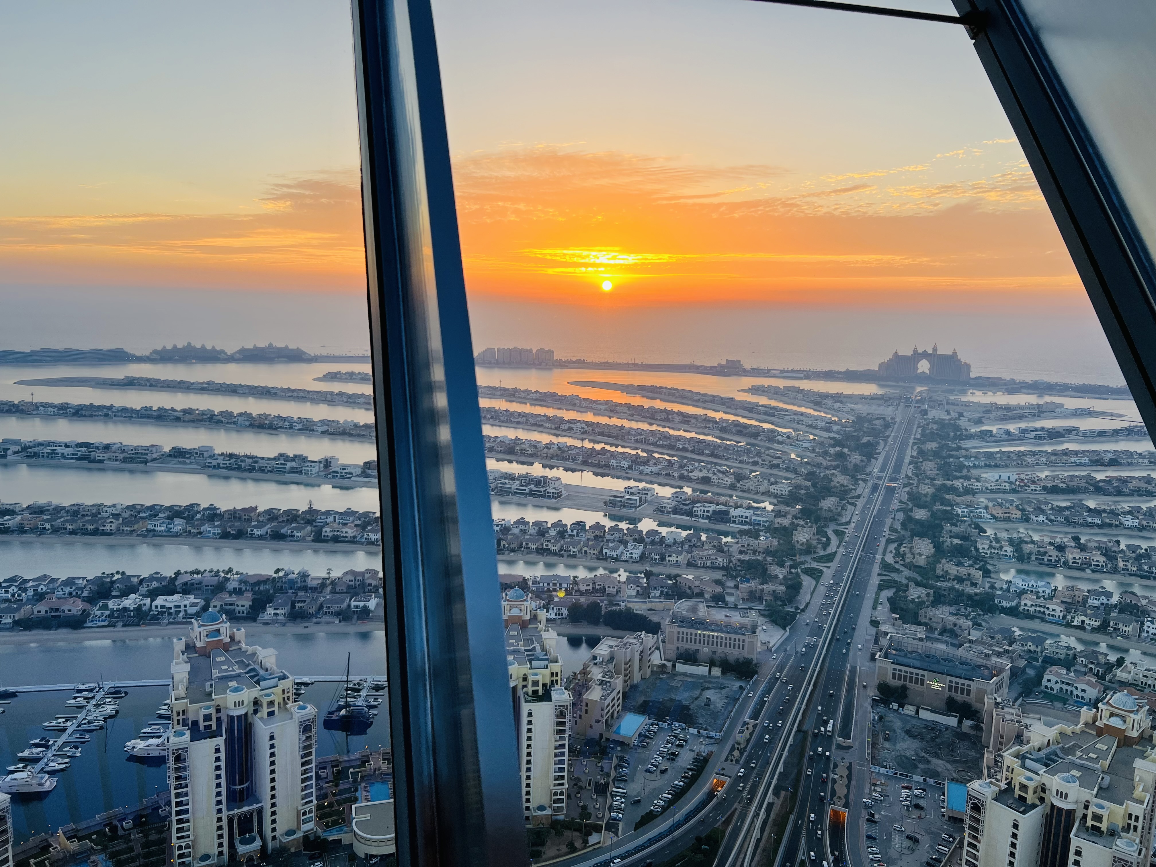 The Palm View with a sunset π