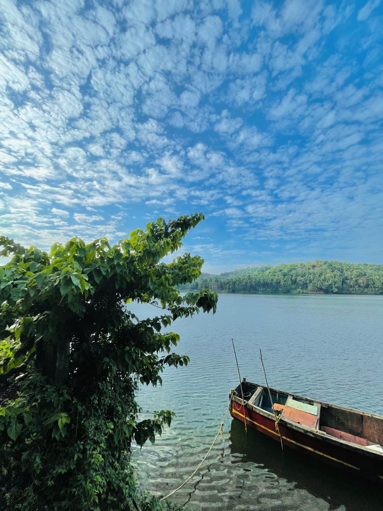 Clouds, river and a broken fishing boat. From our morning walk. Perumanna, Kozhikode, Kerala.