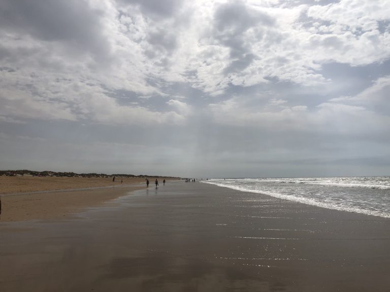 The cloudy sky over the beach of La Antilla (Huelva, Spain).