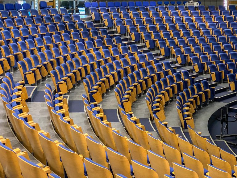 empty auditorium with blue seats