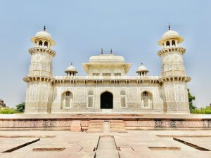 Tomb of I'timād-ud-Daulah aka Baby Taj. Agra, India. A beautiful white building that looks like a temple, in Indian style.