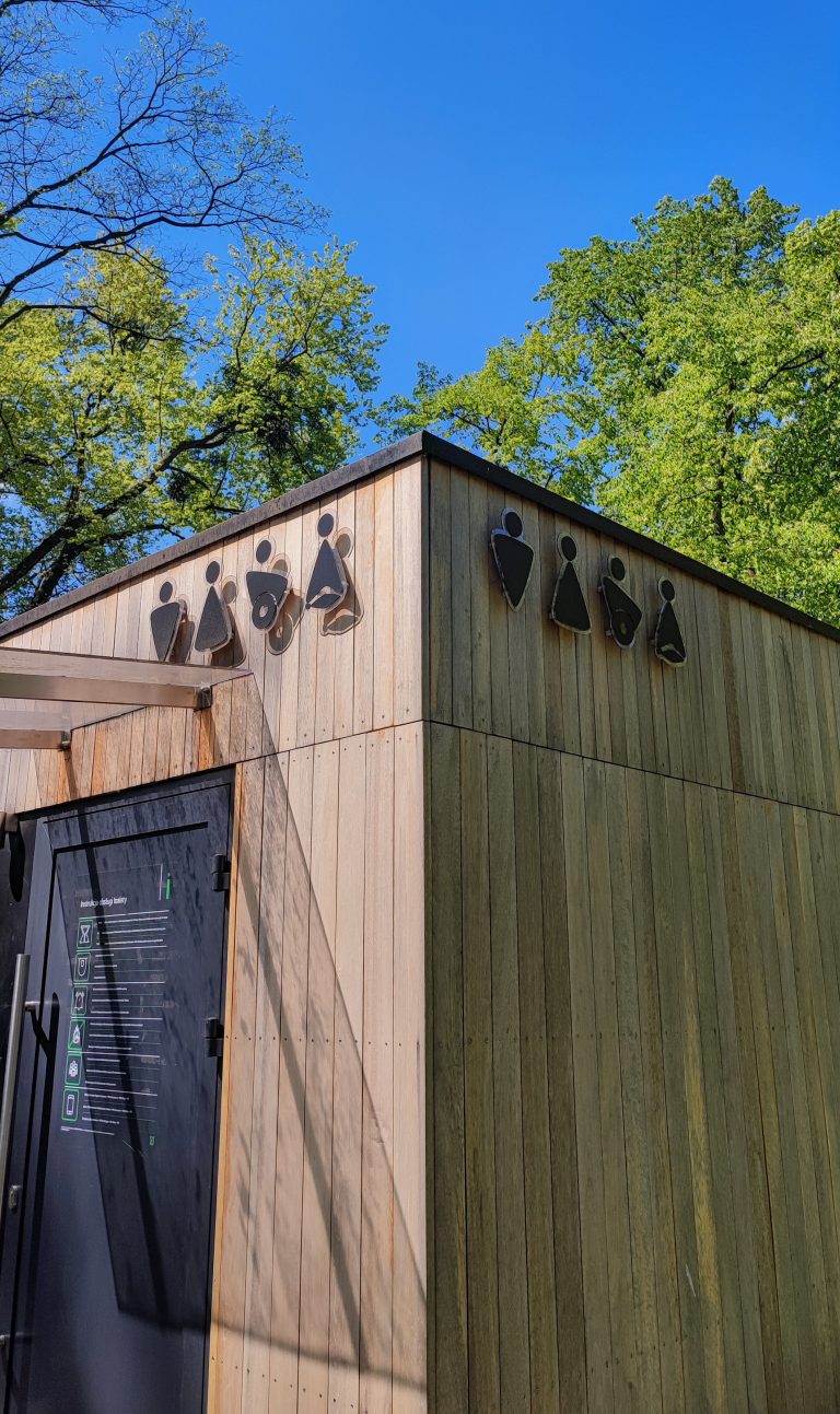 Public toilet in park in Gliwice, Poland. Modern toilet signs, accessibility.