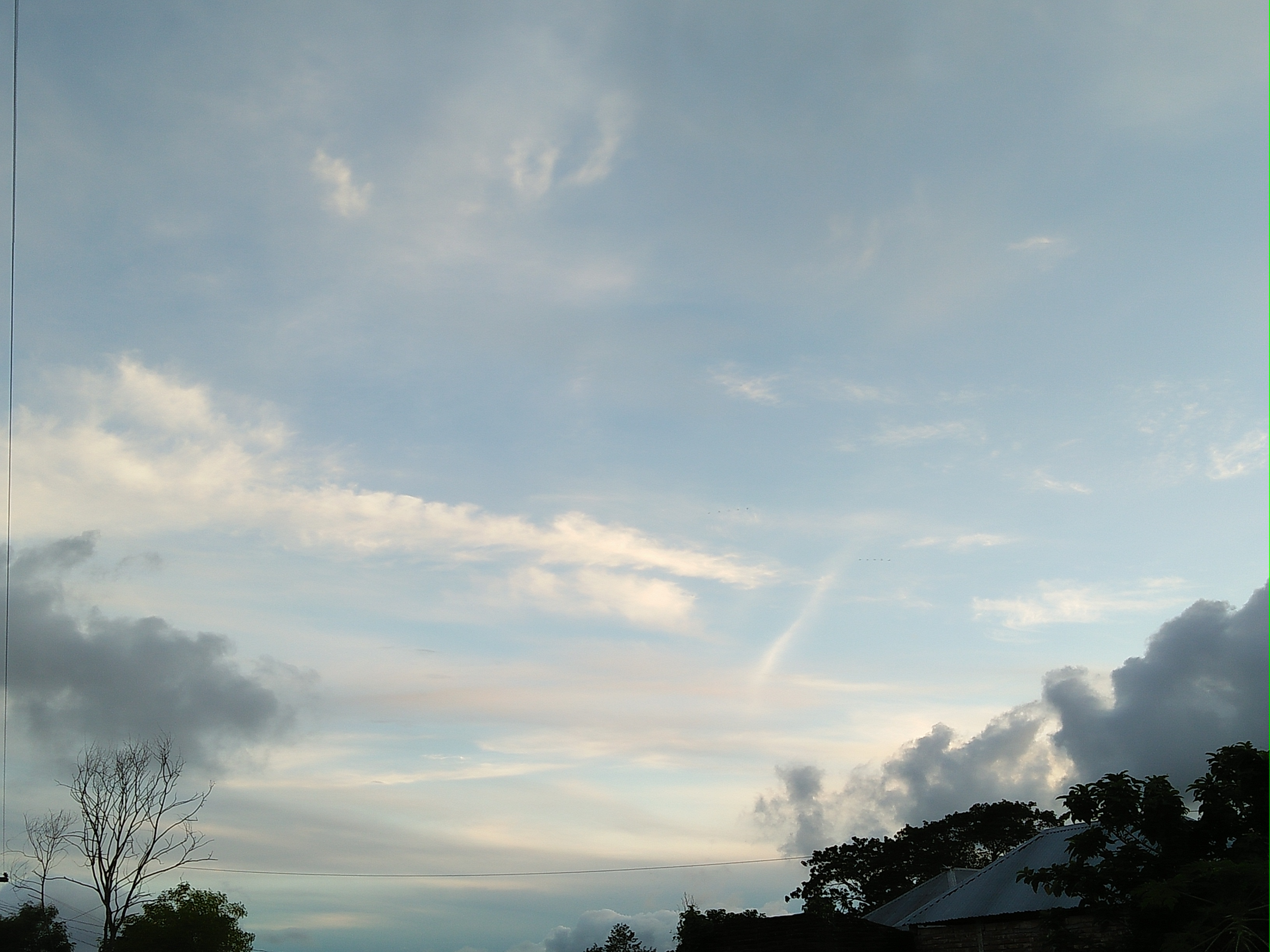 Evening sky over Bangladesh. A few clouds in an otherwise clear sky.