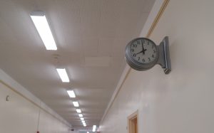 Art deco wall clock in a hallway
