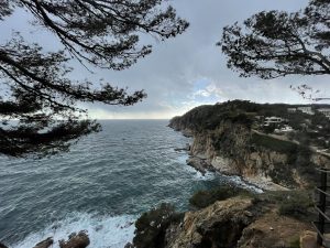 A picture from Tossa de Mar coast, a beautiful village near Girona, Spain.View is from a clifftop looking along the cliff as it goes out into the ocean.
