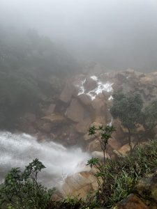 View larger photo: Standing at the top of a waterfall looking down, almost obscured by fog.  India, Cherrapunji, Shillong, Cloud, waterfall