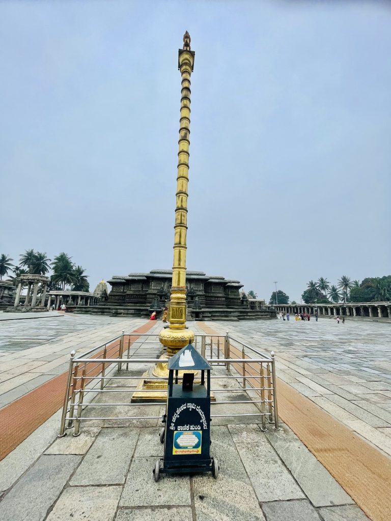 Shri Chennakeshava Swami Temple and its flagstaff in the evening. Belur, Karnataka, India.