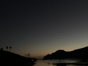 Silhouette of a bay inlet at dusk
