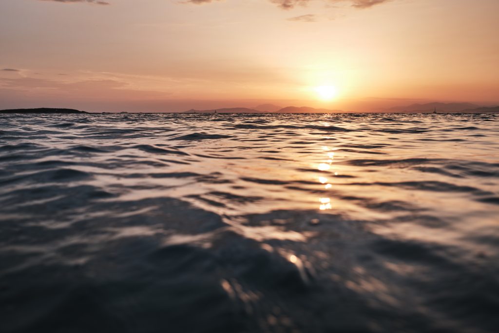 Greek ocean at sunset, calm waters
