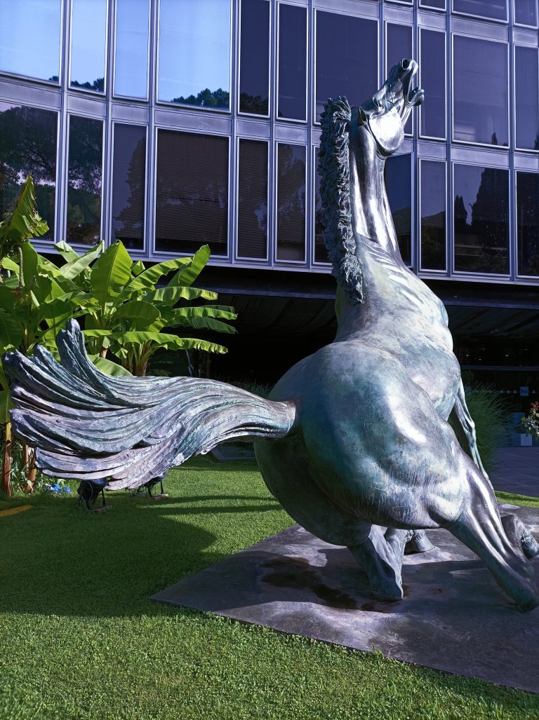 Statue of a falling bronze horse outside RAI italian television headquarters in Rome