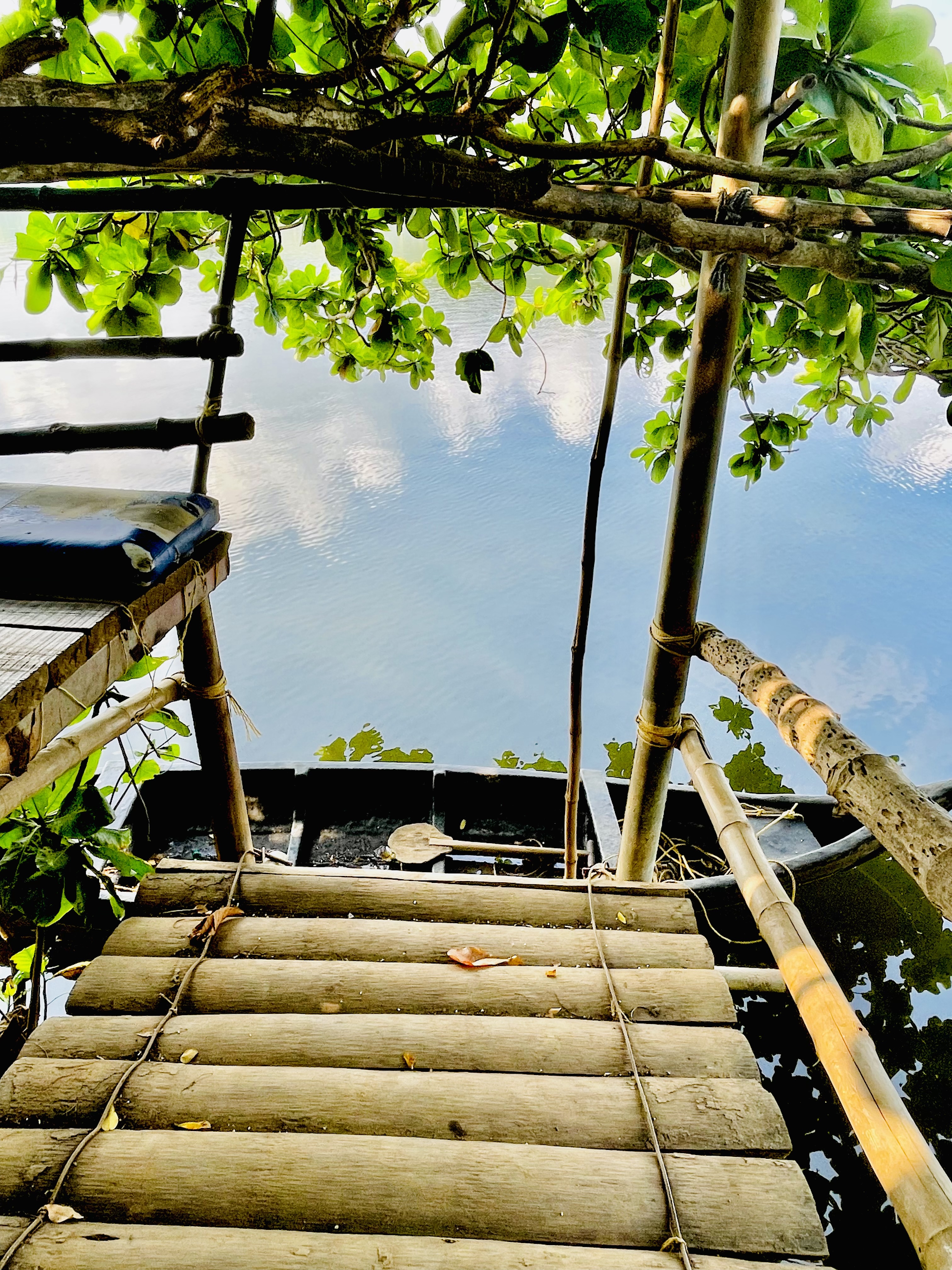 Entrance to the river & fishing boat. On the banks of Chaliyar river. Perumanna, Kozhikode, Kerala.