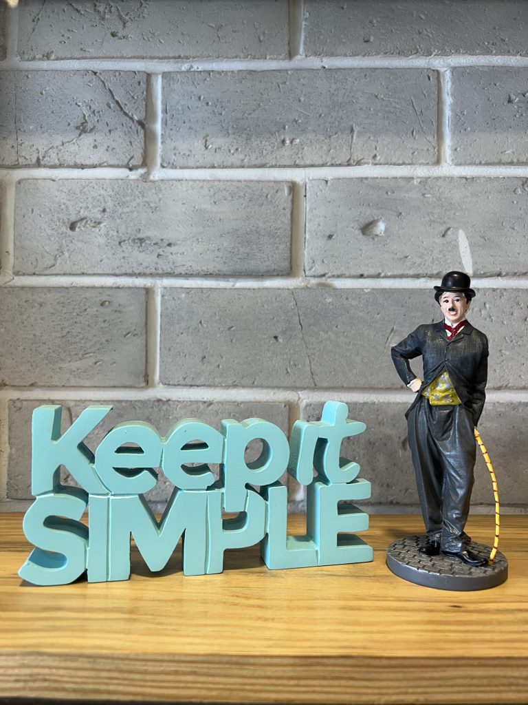 There is one Keep it Simple wooden text and Statue of Charlie chaplin