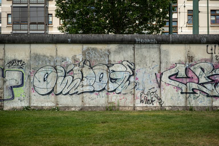 A grafitti-covered restored section of the Berlin Wall, at the Berlin Wall Memorial.