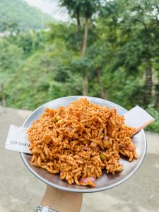 A lady holding Chatpate - Popular fast food in Nepal.