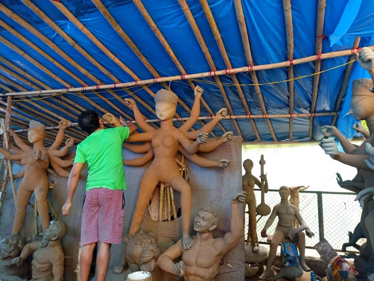 Man creating Hindu idols.