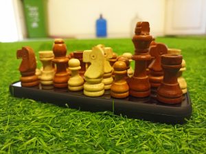 Chess coins over a mobile phone as a base.