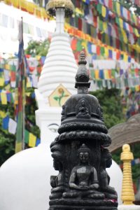 Statues of Buddha, Prayer Flags in the Background