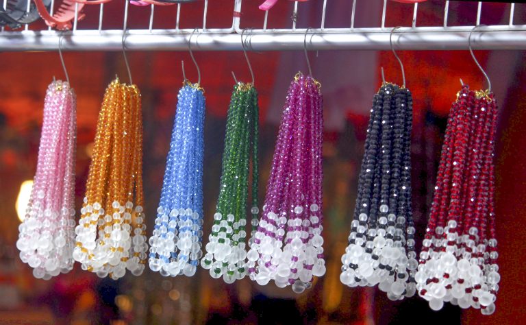 Collections of women’s ornaments hanging in different colors.