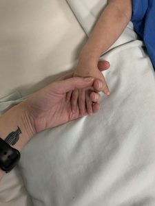 Healing hands, pediatric nurse holding your patient's hand. 