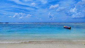 Maldives beautiful sea view with boat in the sea.
