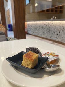 Pineapple cake with honey in the plate at Airport Lounge of Bengaluru.
