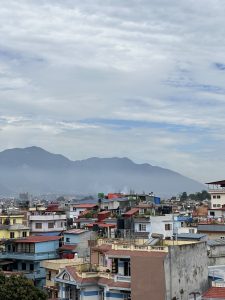 View larger photo: Houses in Kathmandu, Nepal and Mountain and Cloudy Sky on Background