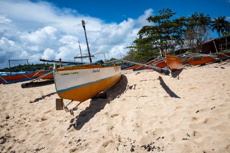 Beautiful Boats on a sandy beach.