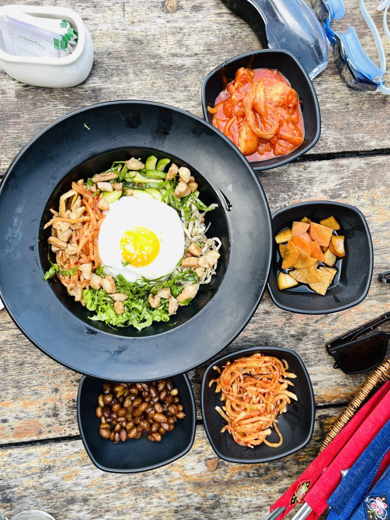 Bibimbap, Korean spicy salad with rice and fried egg – traditionally Korean food style.