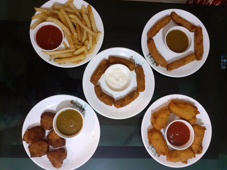 The evening snacks, a full plate of French fries and other delicious dishes.