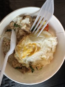 Thai food that contains rice, egg, chicken, etc. 