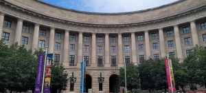 Federal Triangle Washington DC. Imposing horizontal photo of federal tan-gray building with columns
