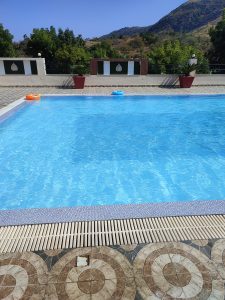 Pool in the foreground, long view of mountains in the background.