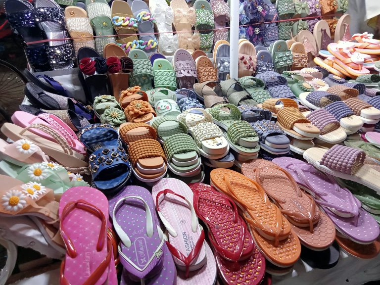 Slippers and sandals in a shoe shop at Burmese Market near Cox’s Bazar sea beach in Bangladesh.