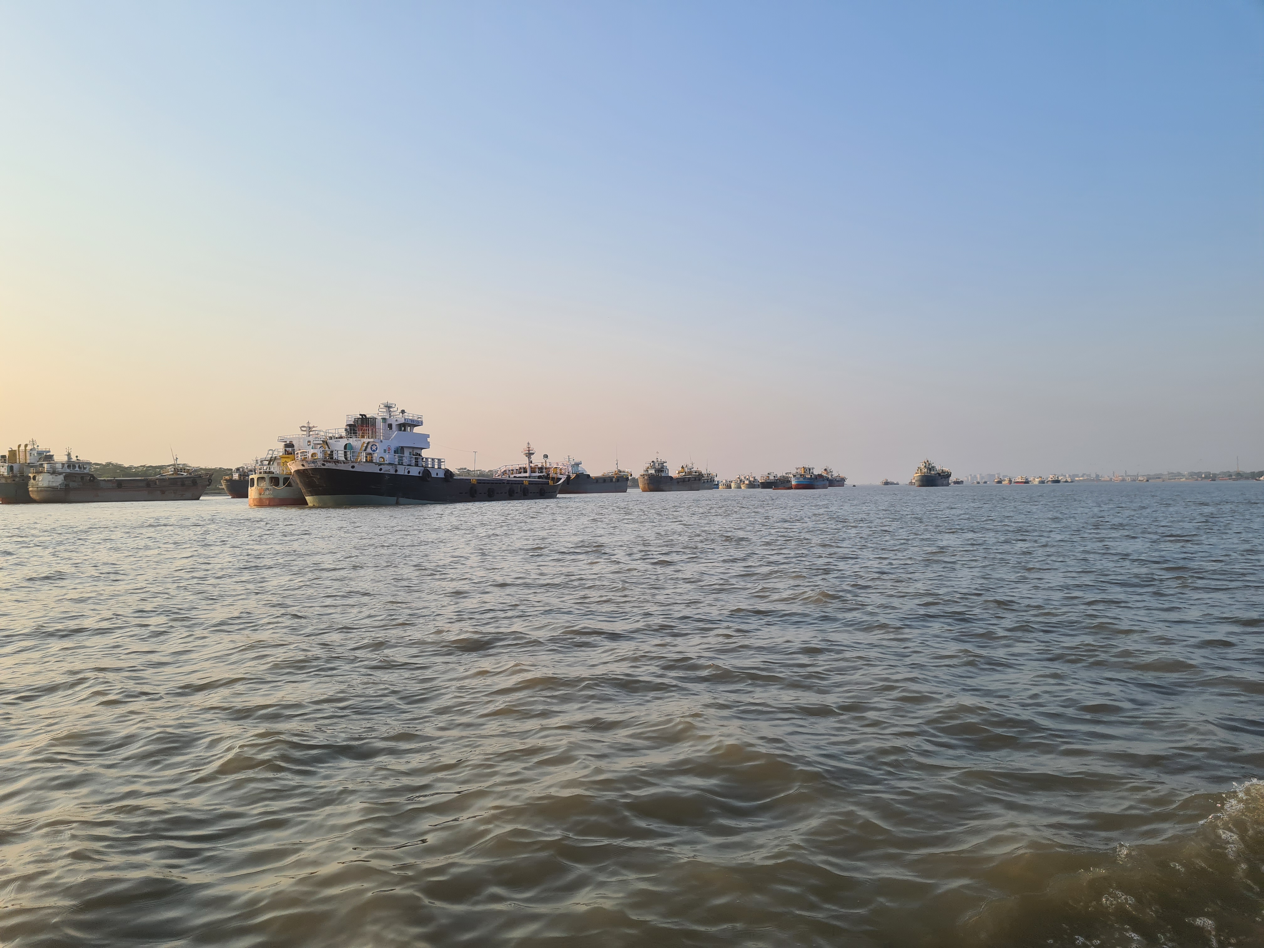 Vessels are moored in the waters of Pashur River, near Mongla in Khulna, Bangladesh.