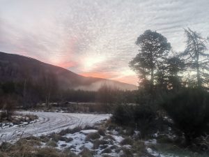 Mackerel sky sunrise with Winter mist rising and a sprinkle of snow