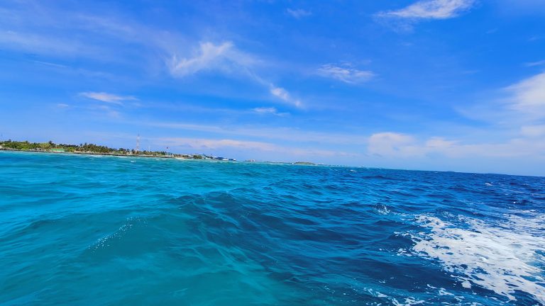 A sea in Maldives with blue water and clear sky.