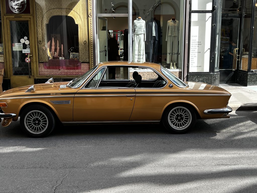 BMW 3.0 CSL classic car parked in an old European city street