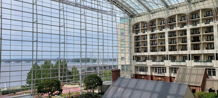 Gaylord National Harbor Resort atrium looking out at the harbor through the atrium windows.