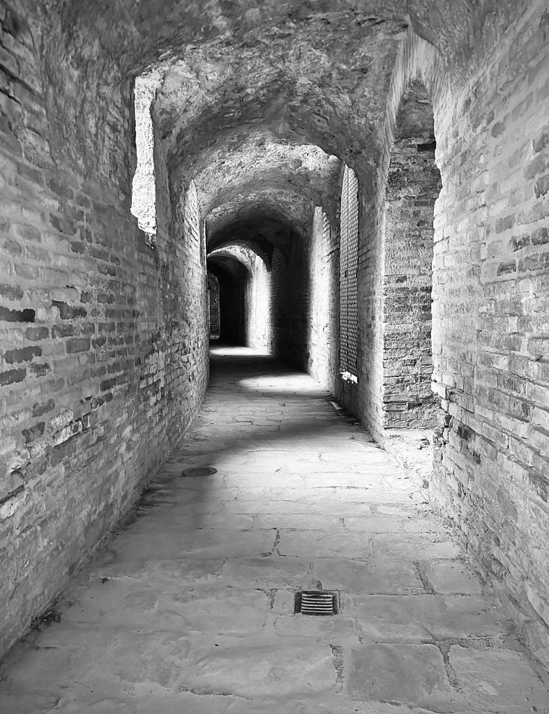 A dark corridor within the Italica Roman ruins in Santiponce, near Seville Spain.
