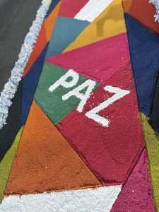 "Paz" - Sawdust and flower carpet on a street in Cartago, Costa Rica