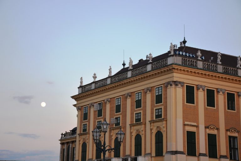 Full moon and Sch?nbrunn Palace. An evening view from Sch?nbrunn Palace Garden, Vienna, Austria.